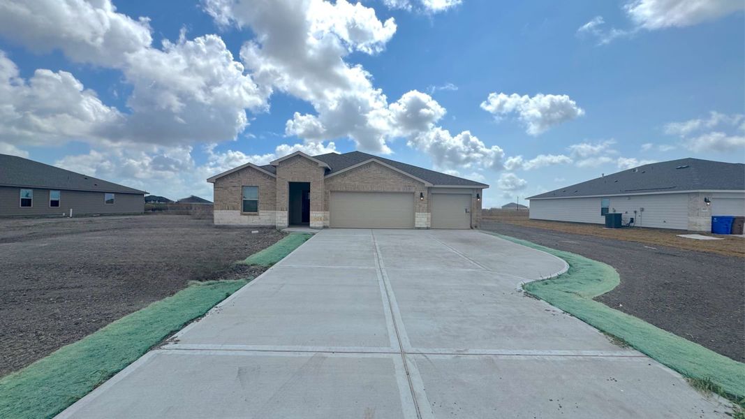 Front exterior of a new home in The Reserve at London, Corpus Christi, TX, highlighting curb appeal (Image 15). Front exterior of a new home in The Reserve at London, Corpus Christi, TX, highlighting curb appeal (Image 15).