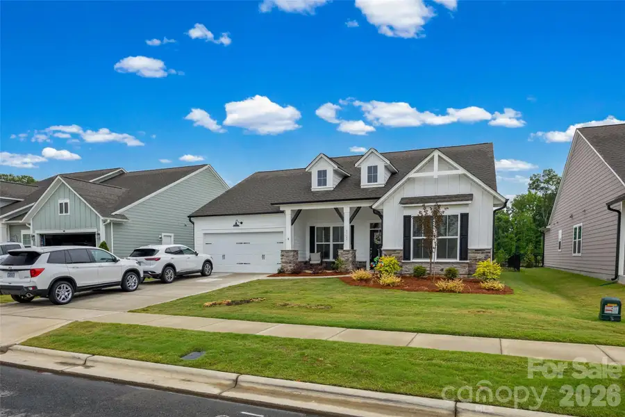 Front exterior of a new home in , Harrisburg, NC, highlighting curb appeal (Image 2). Front exterior of a new home in , Harrisburg, NC, highlighting curb appeal (Image 2).