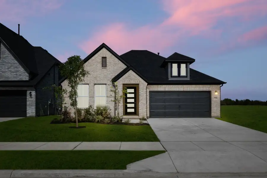 Representative exterior photo of a completed home built from the Liberty by Rockwell Homes in Creekside, Royse City, TX (Image 30).