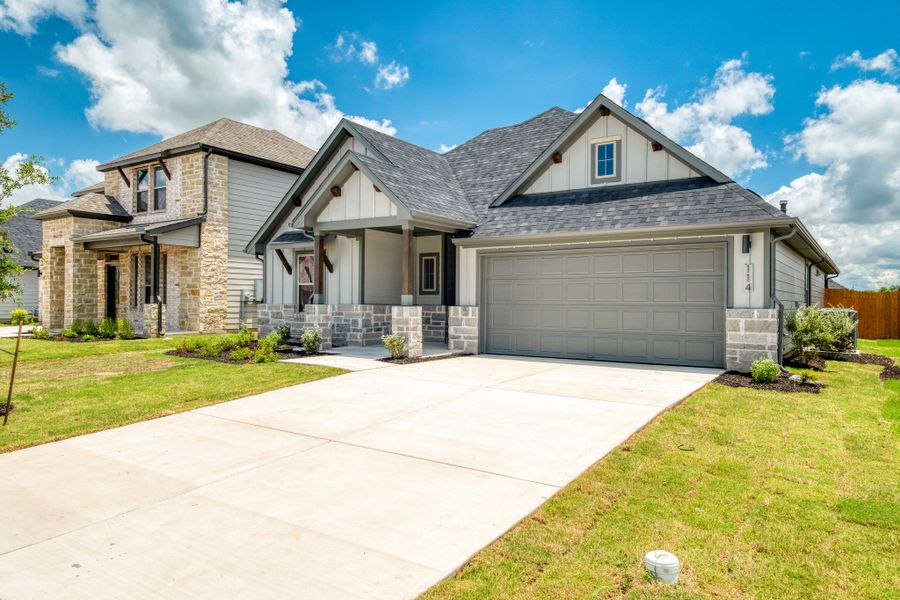 Front exterior of a new home in Prairie Winds, Hutto, TX, highlighting curb appeal (Image 17).