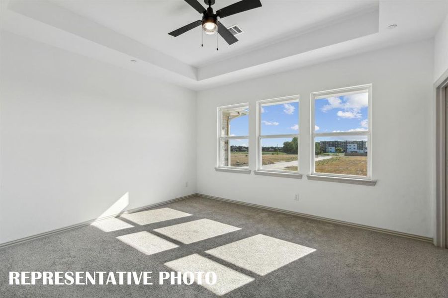 This peaceful and relaxing owner's bedroom is the perfect place for you to relax and unwind at the end of the day.  REPRESENTATIVE PHOTO