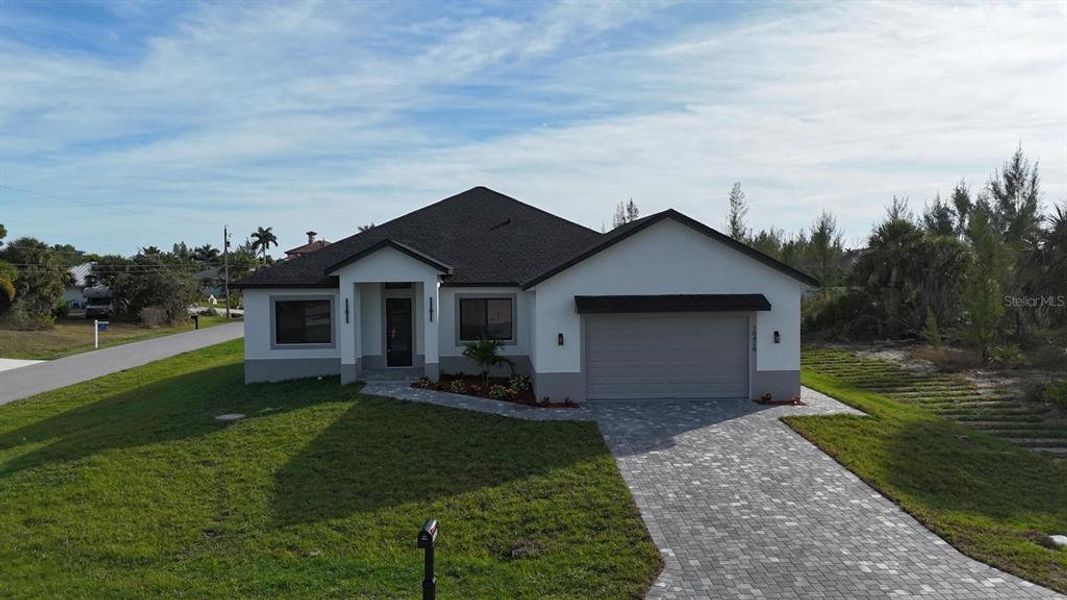 Front exterior of a new home in , Port Charlotte, FL, highlighting curb appeal (Image 34). Front exterior of a new home in , Port Charlotte, FL, highlighting curb appeal (Image 34).