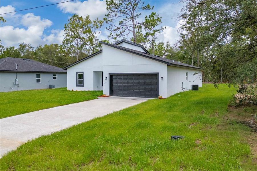 Front exterior of a new home in , Citrus Springs, FL, highlighting curb appeal (Image 20).