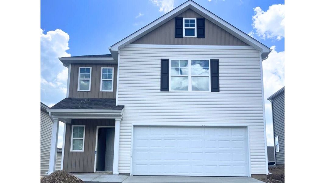 Front exterior of a new home in Johnson Farms, Greeneville, TN, highlighting curb appeal (Image 1).