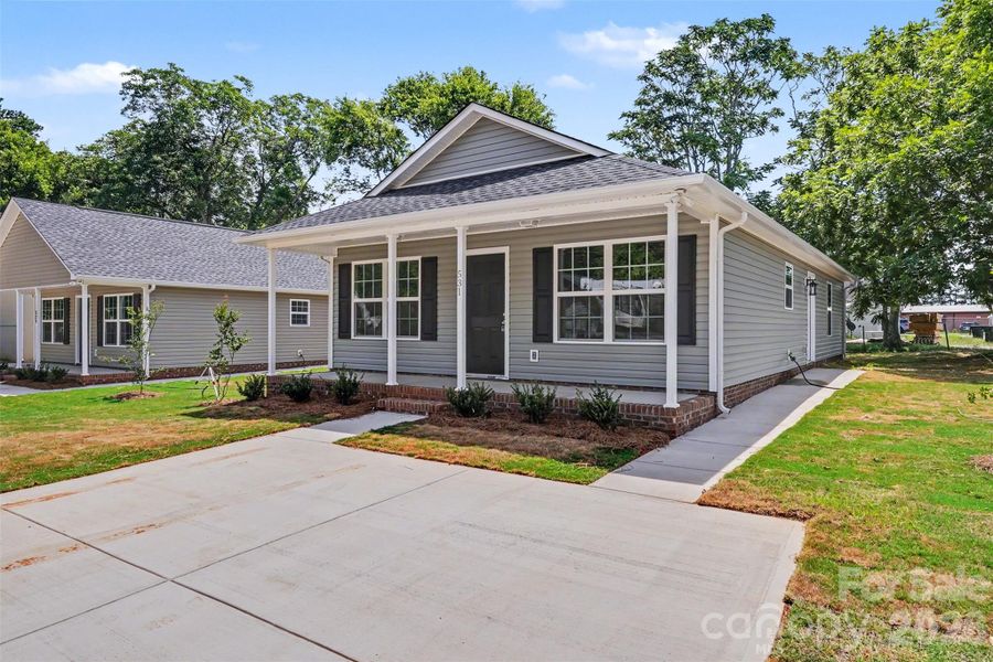 Front exterior of a new home in , Rock Hill, SC, highlighting curb appeal (Image 1). Front exterior of a new home in , Rock Hill, SC, highlighting curb appeal (Image 1).