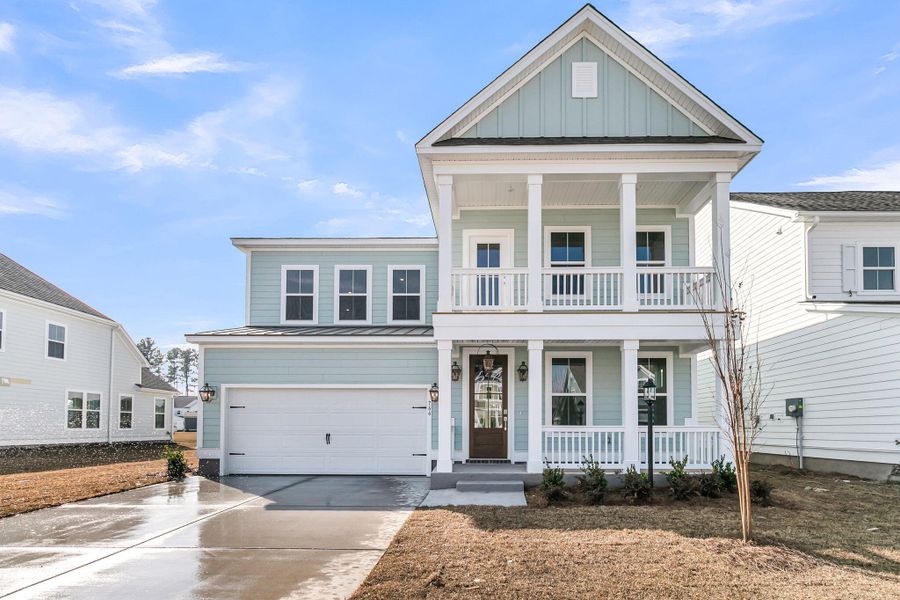 Front exterior of a new home in Tidewater at Lakes of Cane Bay, Summerville, SC, highlighting curb appeal (Image 1). Front exterior of a new home in Tidewater at Lakes of Cane Bay, Summerville, SC, highlighting curb appeal (Image 1).