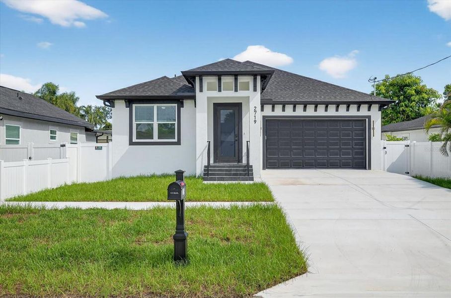 Front exterior of a new home in , Tampa, FL, highlighting curb appeal (Image 28).