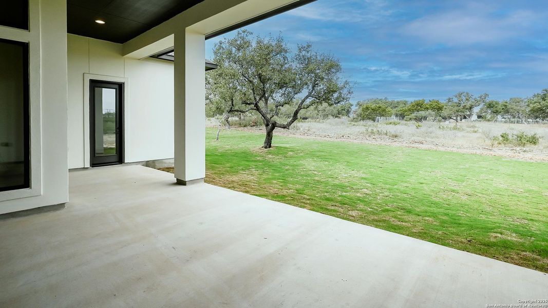 Exterior details and patio area of a home in The Preserve At Elm Creek 1 Acre, Canyon Lake (Image 3). Exterior details and patio area of a home in The Preserve At Elm Creek 1 Acre, Canyon Lake (Image 3).