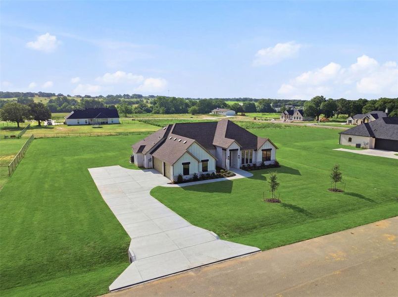 Front exterior of a new home in , Azle, TX, highlighting curb appeal (Image 24). Front exterior of a new home in , Azle, TX, highlighting curb appeal (Image 24).