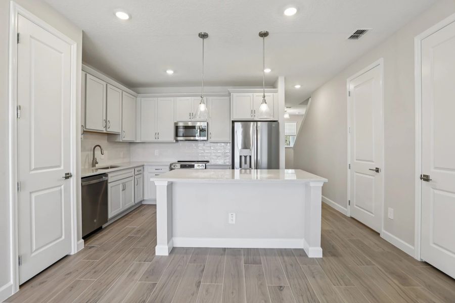 Kitchen also features a large kitchen island, ideal for entertaining or weeknight dinners