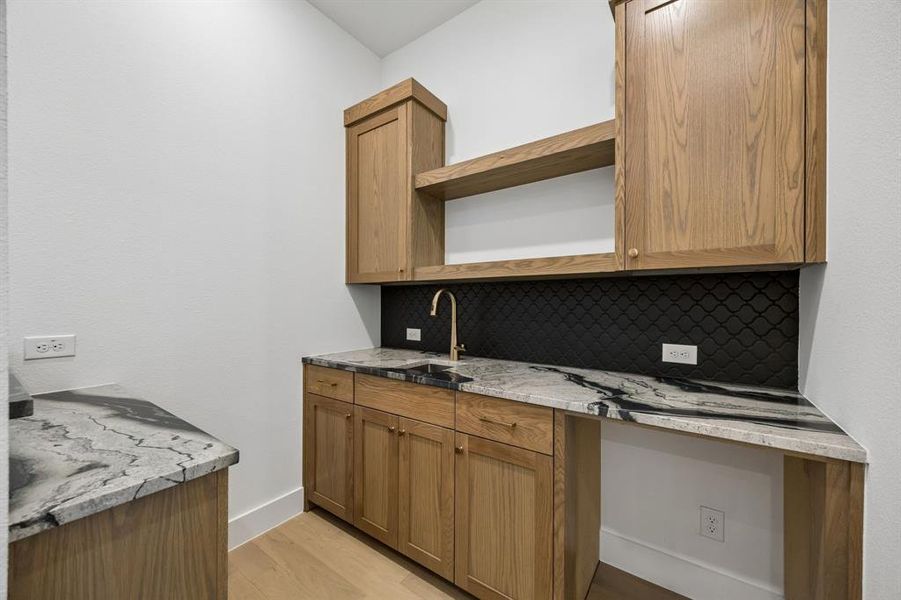 Located jut off the family room, this wonderful wet bar provides an ideal entertaining space.