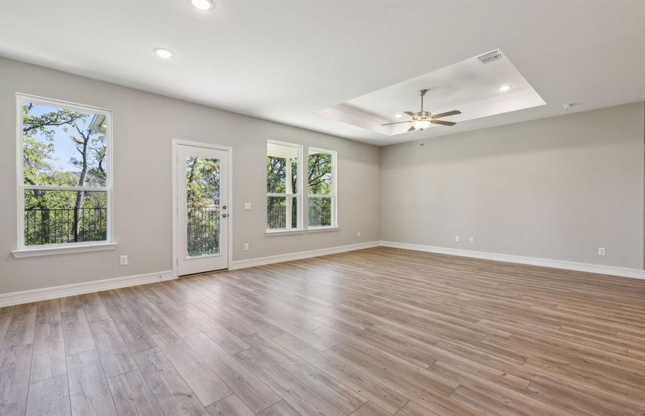 Bright gathering room with large windows *real home pictured