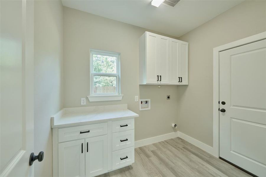 Love the laundry rm.  Great storage & folding counter