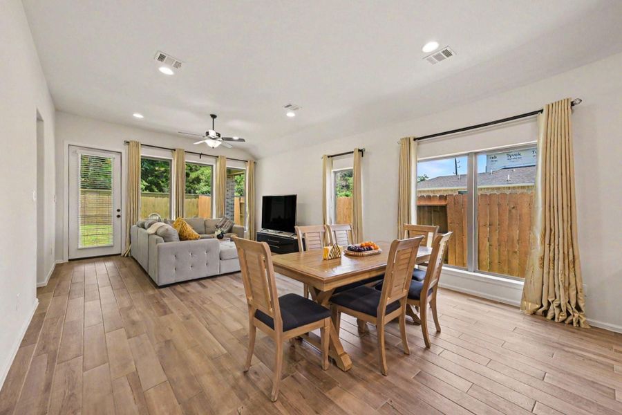 Kitchen and breakfast nook seamlessly flows into the living room. Kitchen and breakfast nook seamlessly flows into the living room.
