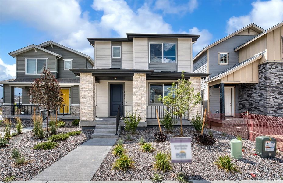 Front exterior of a new home in Painted Prairie, Aurora, CO, highlighting curb appeal (Image 19).