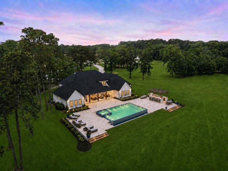 AI generated rendering showing the possibility of adding a resort style infinity pool and outdoor entertaining space to the property. AI generated rendering showing the possibility of adding a resort style infinity pool and outdoor entertaining space to the property.