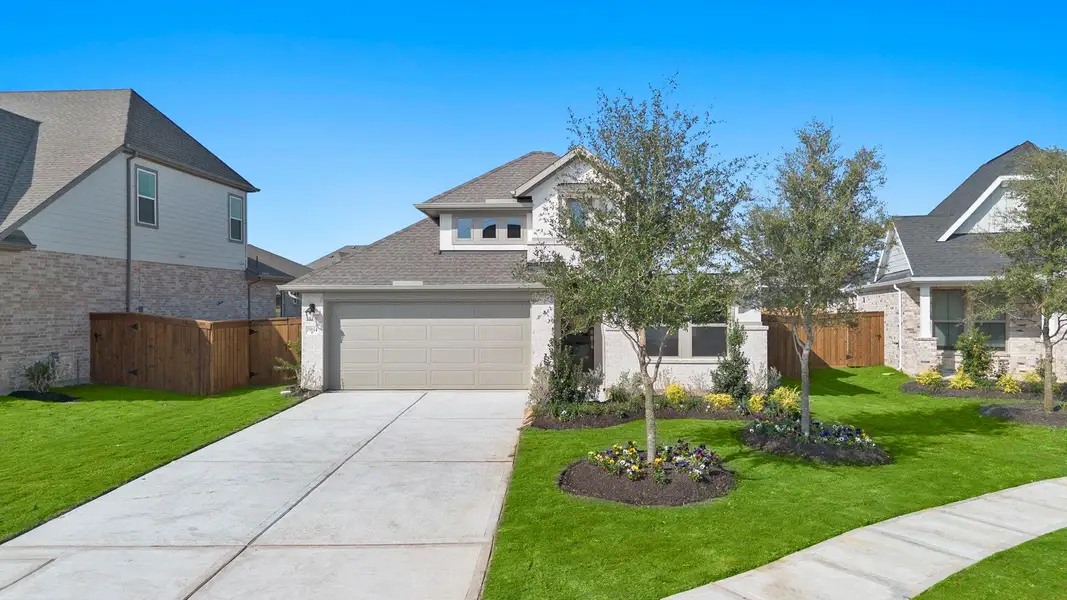 Front exterior of a new home in Dunham Pointe 50', Cypress, TX, highlighting curb appeal (Image 2).