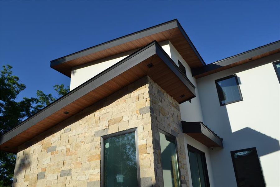 Exterior view of stone siding and stucco siding Exterior view of stone siding and stucco siding