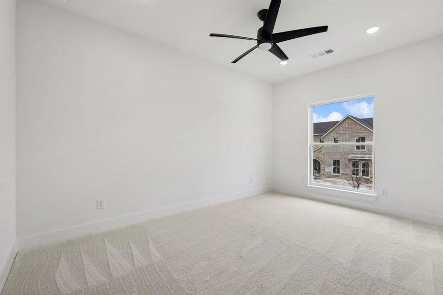 Unfurnished room with carpet, a ceiling fan, and recessed lighting