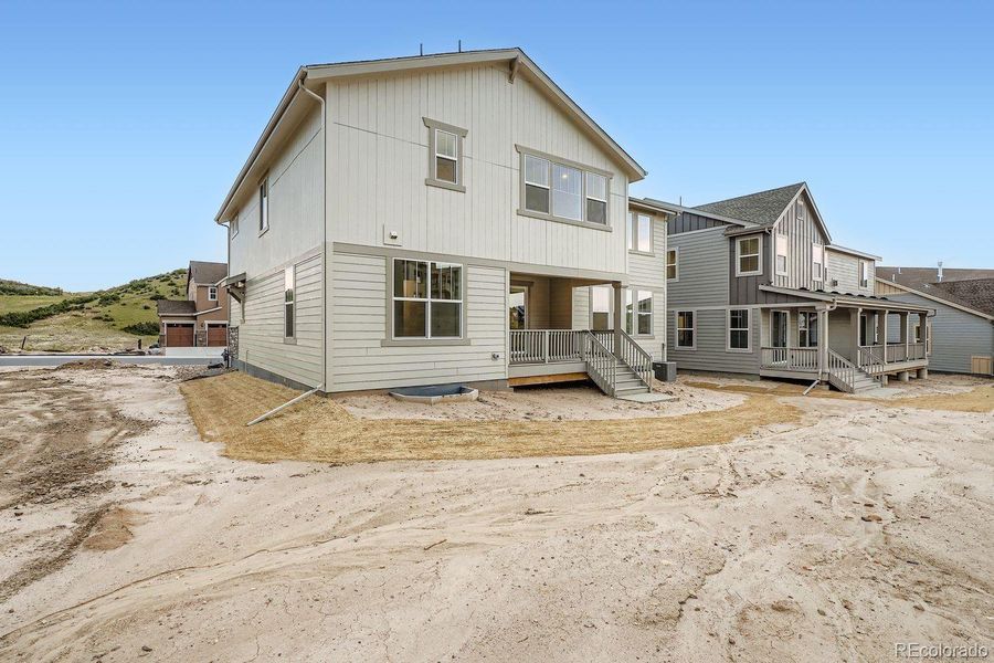 Front exterior of a new home in Macanta: The Grand Collection, Castle Rock, CO, highlighting curb appeal (Image 12).