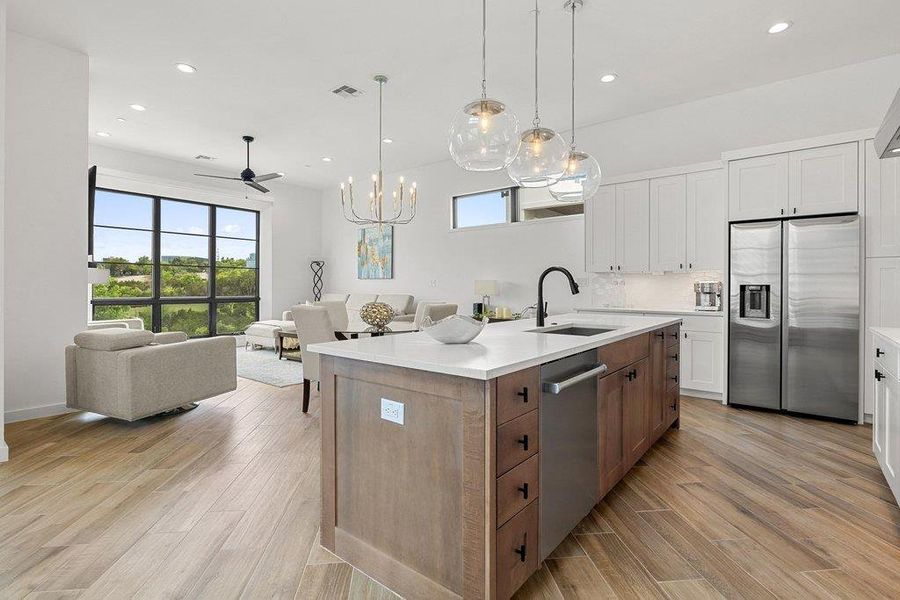 Open-concept living space with wood-finish flooring