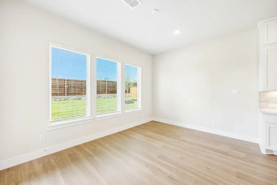 Spacious, unfurnished interior of a new home in Rainwater Crossing, Celina (Image 27).