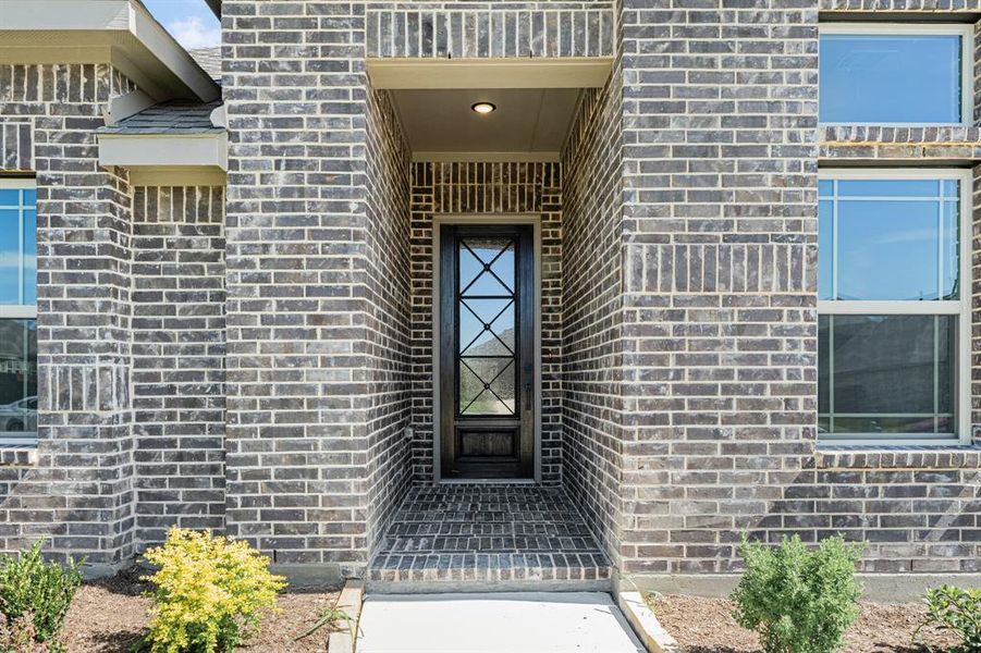 Front exterior of a new home in Hampton Park, Glenn Heights, TX, highlighting curb appeal (Image 24). Front exterior of a new home in Hampton Park, Glenn Heights, TX, highlighting curb appeal (Image 24).