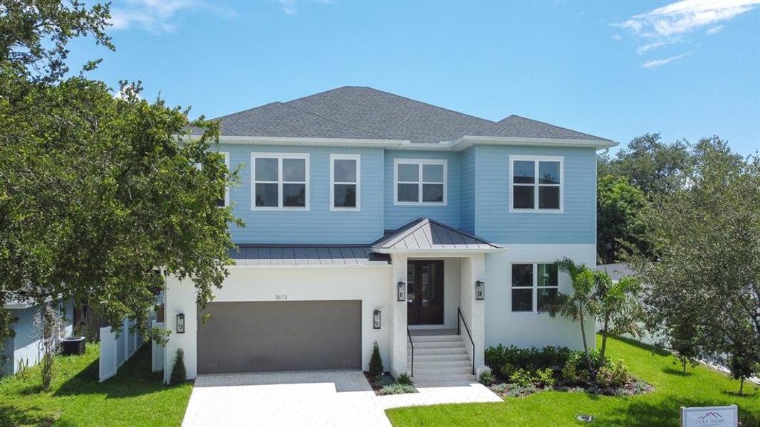 Front exterior of a new home in , Tampa, FL, highlighting curb appeal (Image 28).