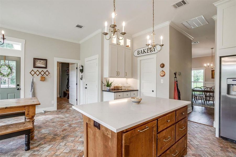 Kitchen with brick flooring in herringbone pattern. Kitchen with brick flooring in herringbone pattern.