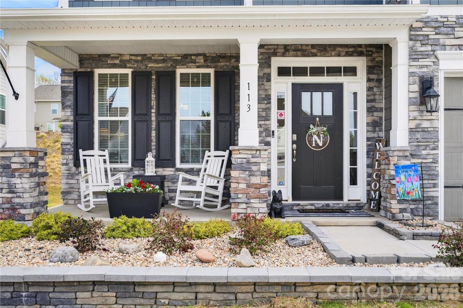 Covered front porch is a welcoming feature.