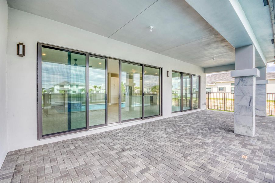 Exterior details and patio area of a home in Apex at Avenir, Palm Beach Gardens (Image 29).