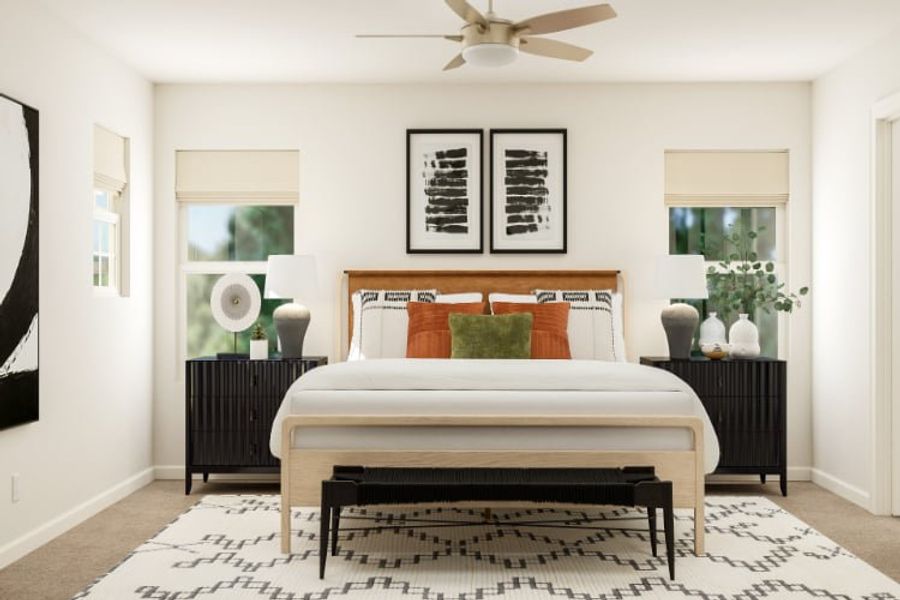 A bedroom with a bed and a fan.