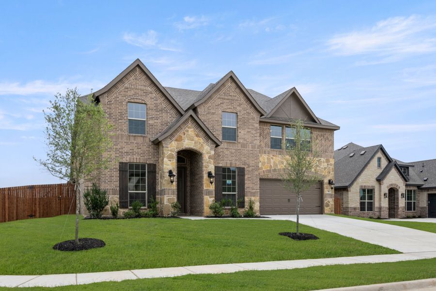 Front exterior of a new home in Mockingbird Hills, Joshua, TX, highlighting curb appeal (Image 2).