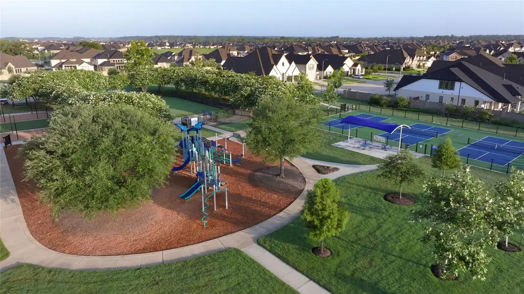 The Amira community playground, known as Pony Park, is a unique, nature-inspired play space tucked under large, mature trees that provide significant natural shade.