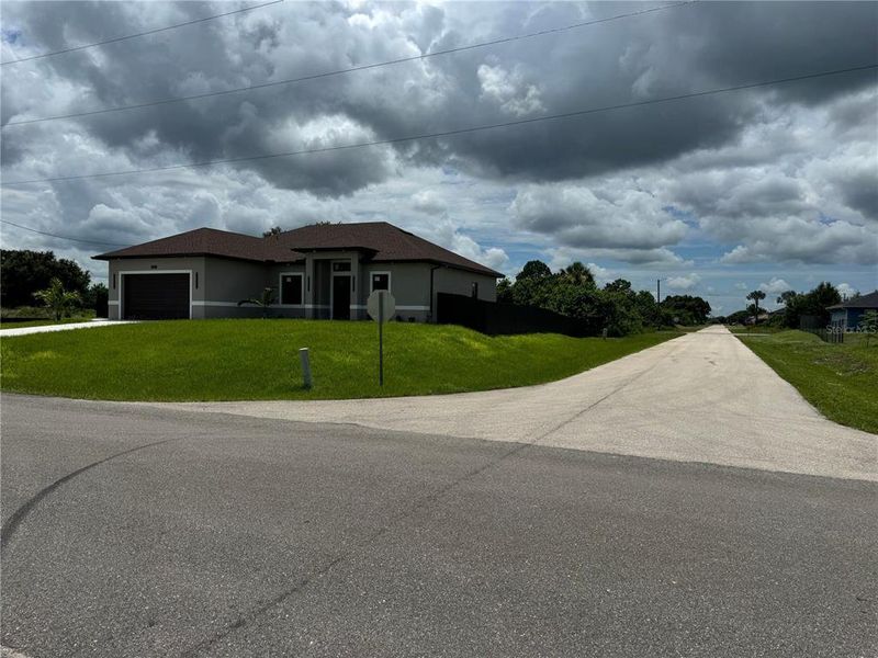 Front exterior of a new home in , Lehigh Acres, FL, highlighting curb appeal (Image 18).