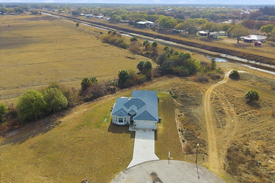Aerial View of the Front Elevation and Property Entrance and Full land