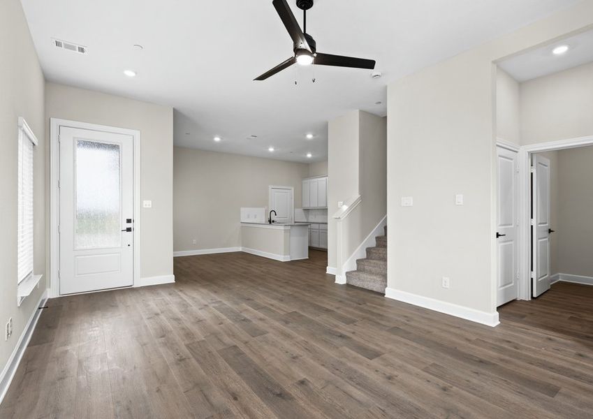 The living room sits right off of the kitchen and dining area.