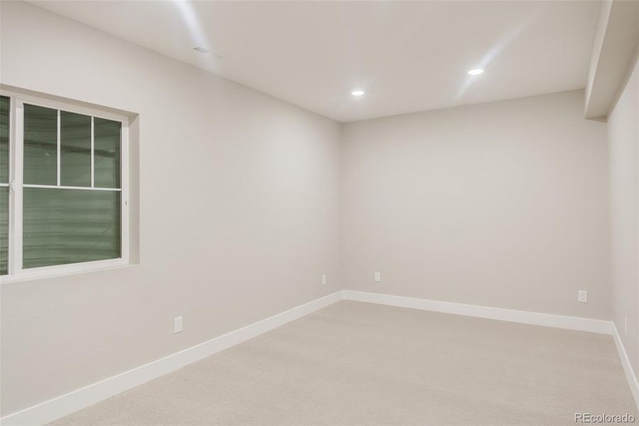 The home's third bedroom is located on the basement level. The home's third bedroom is located on the basement level.