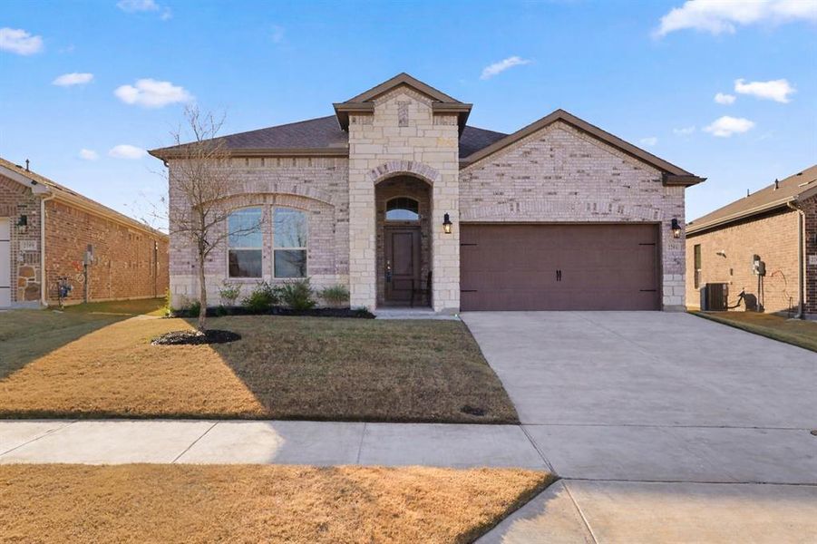 Front exterior of a new home in , Anna, TX, highlighting curb appeal (Image 1). Front exterior of a new home in , Anna, TX, highlighting curb appeal (Image 1).