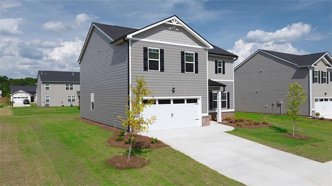 Front exterior of a new home in Jackson Landing, Jefferson, GA, highlighting curb appeal (Image 15).
