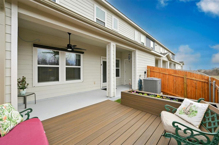 Deck with an outdoor living space, central AC, and ceiling fan