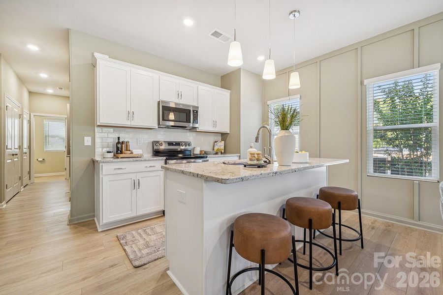 Example rendering Only - Home under construction with estimated completion in April or May.