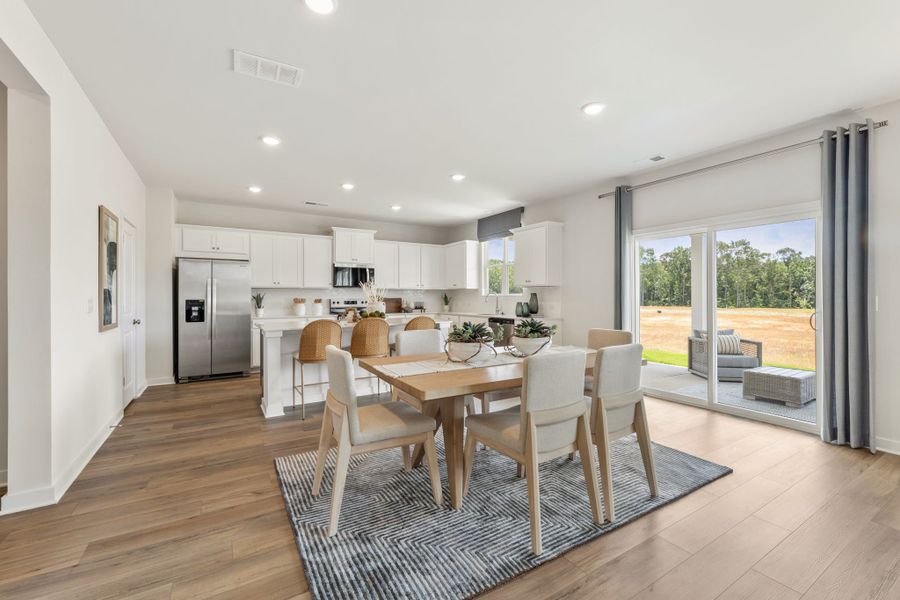 A kitchen and dining room. A kitchen and dining room.