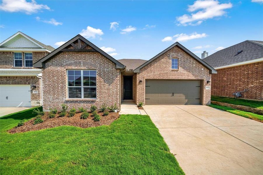 Front exterior of a new home in Liberty Pointe, Gainesville, TX, highlighting curb appeal (Image 23). Front exterior of a new home in Liberty Pointe, Gainesville, TX, highlighting curb appeal (Image 23).