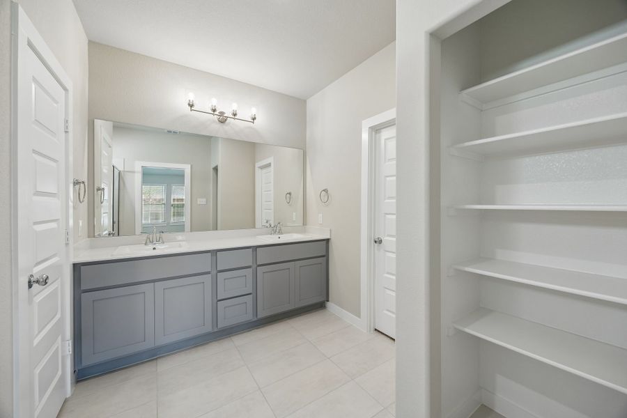 Primary Bathroom in the Emmy II home plan by Trophy Signature Homes - REPRESENTATIVE PHOTO