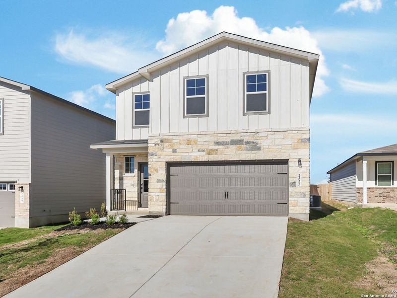 Front exterior of a new home in Applewhite Meadows, San Antonio, TX, highlighting curb appeal (Image 18).