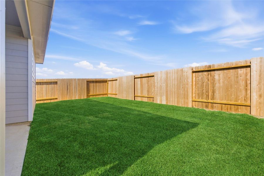 Exterior details and patio area of a home in Sweetgrass Village, Crosby (Image 28). Exterior details and patio area of a home in Sweetgrass Village, Crosby (Image 28).