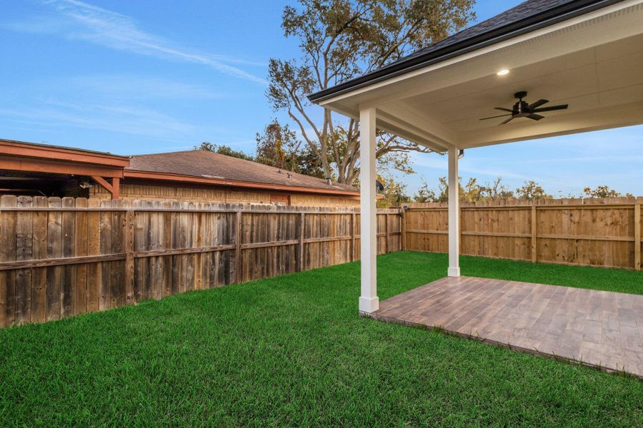 Covered patio with French doors, ideal for outdoor entertaining and relaxing evenings. Covered patio with French doors, ideal for outdoor entertaining and relaxing evenings.