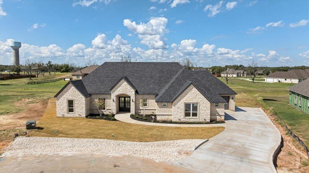 Front exterior of a new home in Pecan Plantation, Granbury, TX, highlighting curb appeal (Image 26).