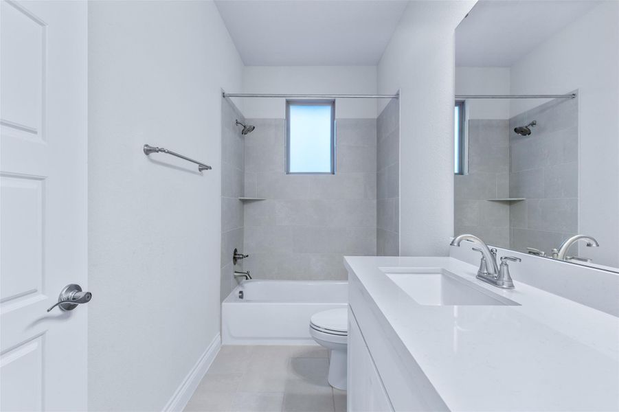 Full bath featuring vanity and shower / tub combination